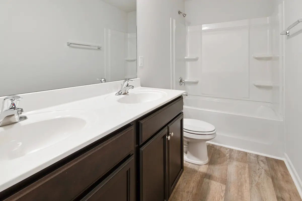 Bathroom shower, tub, vanity, mirror, and finished wall surfaces