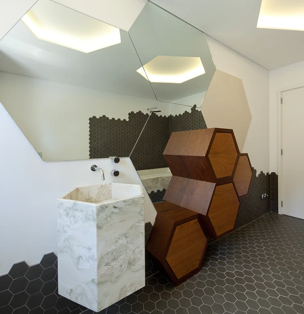 Walk-in shower remodel with tile surfaces and clean finish details